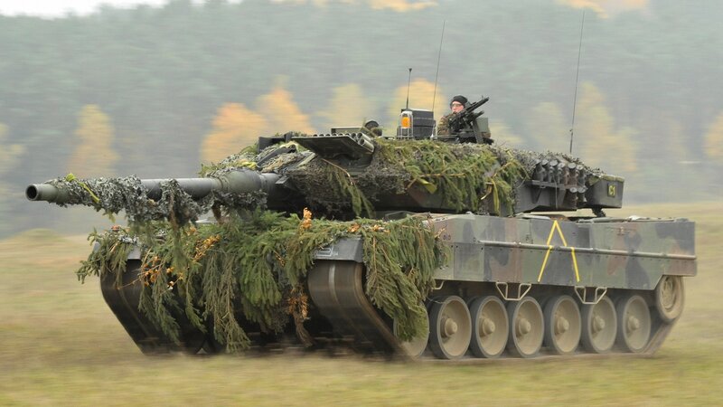 Camouflaged Tank in Motion