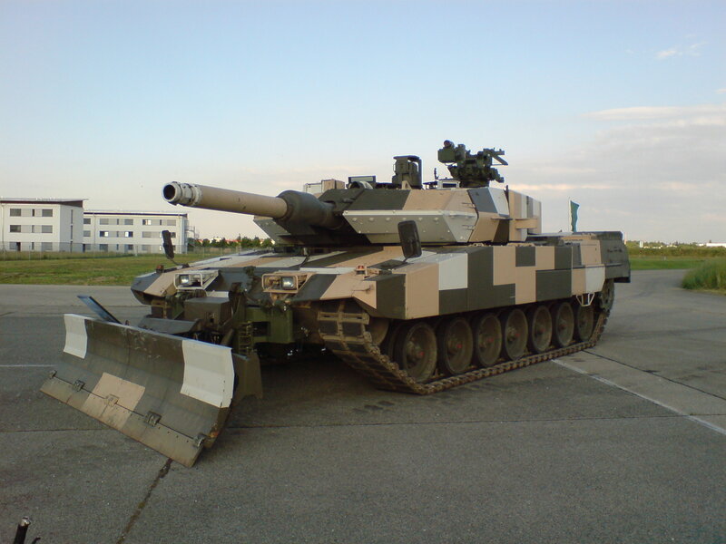 Camouflaged tank on tarmac