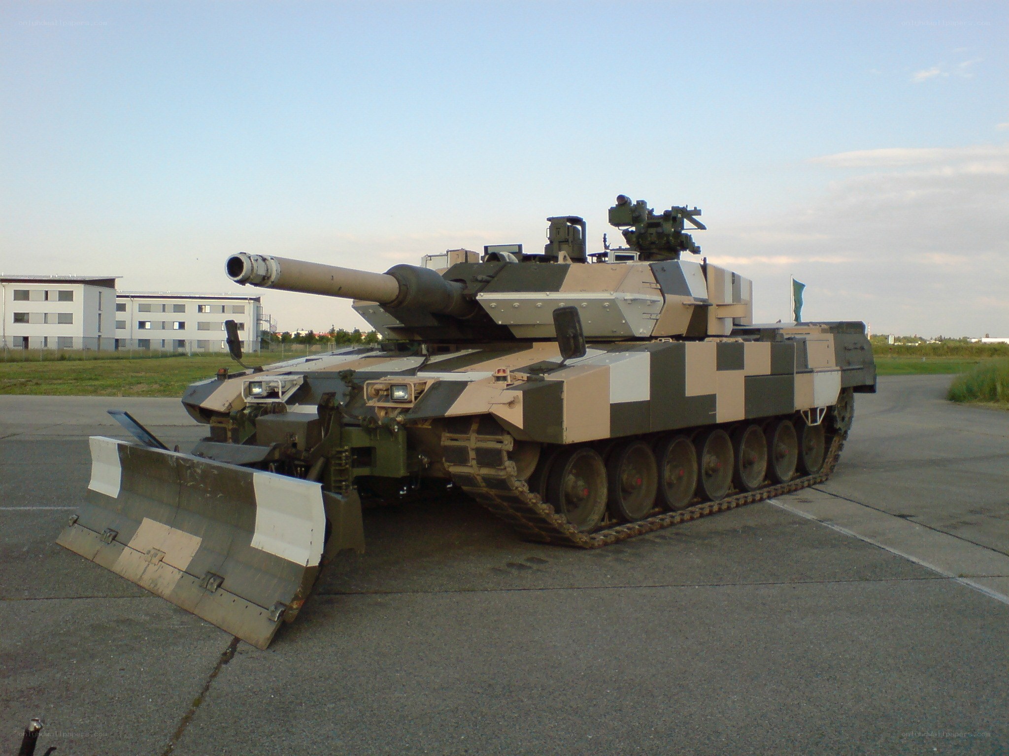 Camouflaged tank on tarmac
