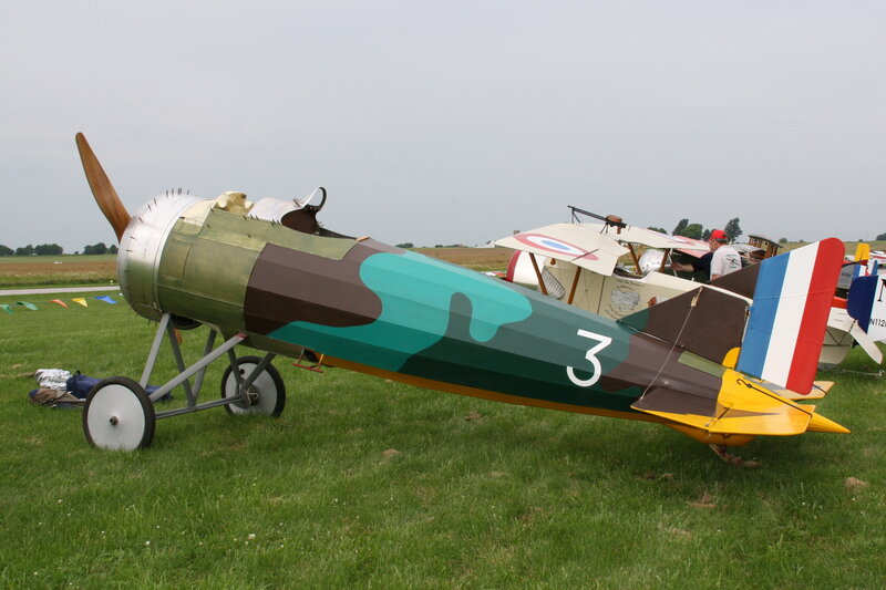 Camouflaged vintage airplane on display