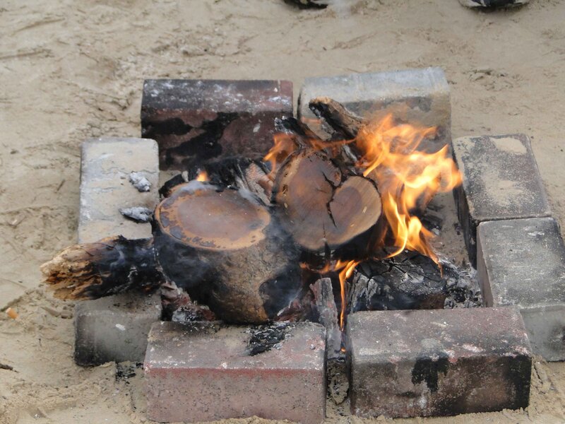 Campfire burning on the beach