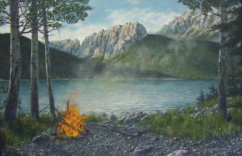 Campfire by a mountain lake