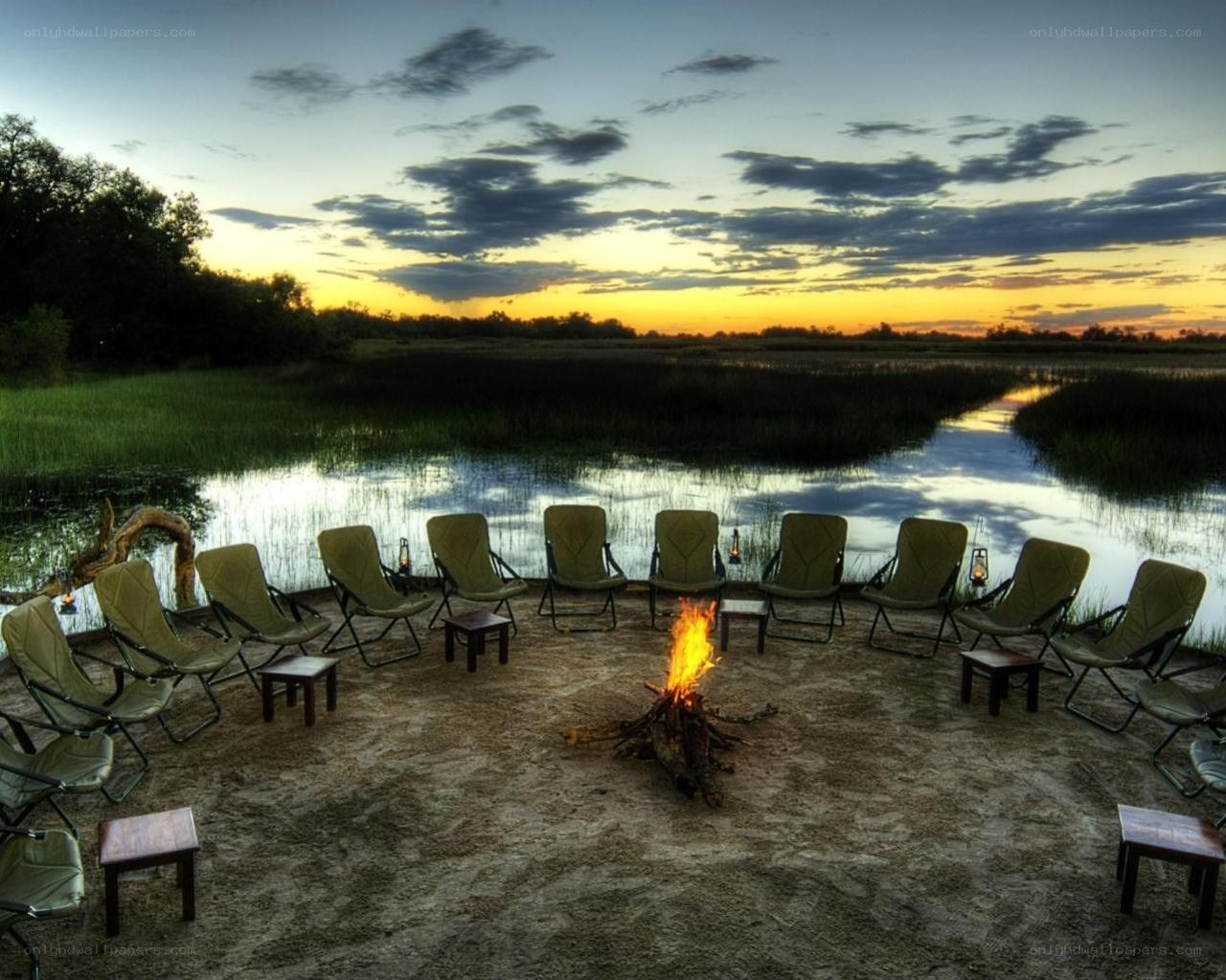 Campfire by the river at sunset
