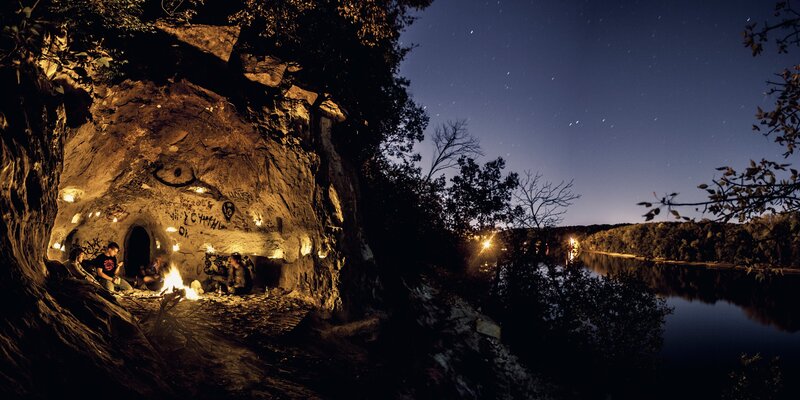 Campfire in a cave at night