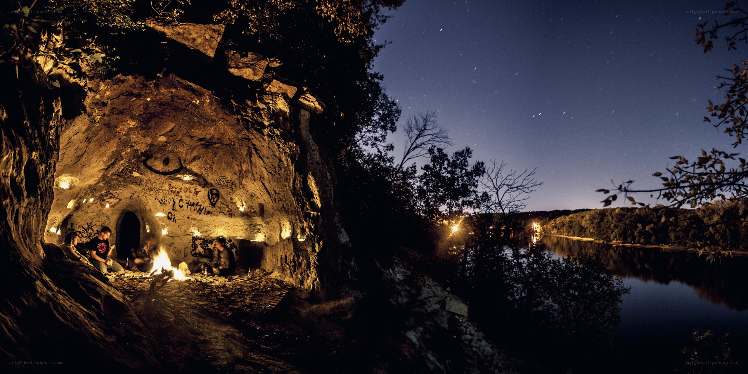 Campfire in a cave at night