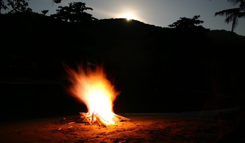 campfire on a beach at night