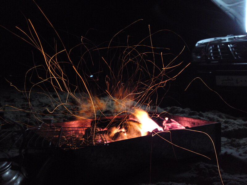 campfire sparks at night