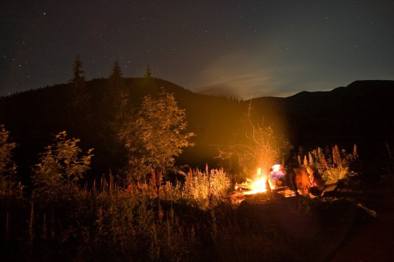 Campfire under starry sky
