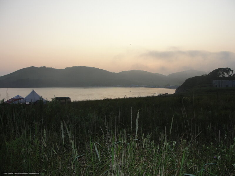 Camping by the lake at dawn