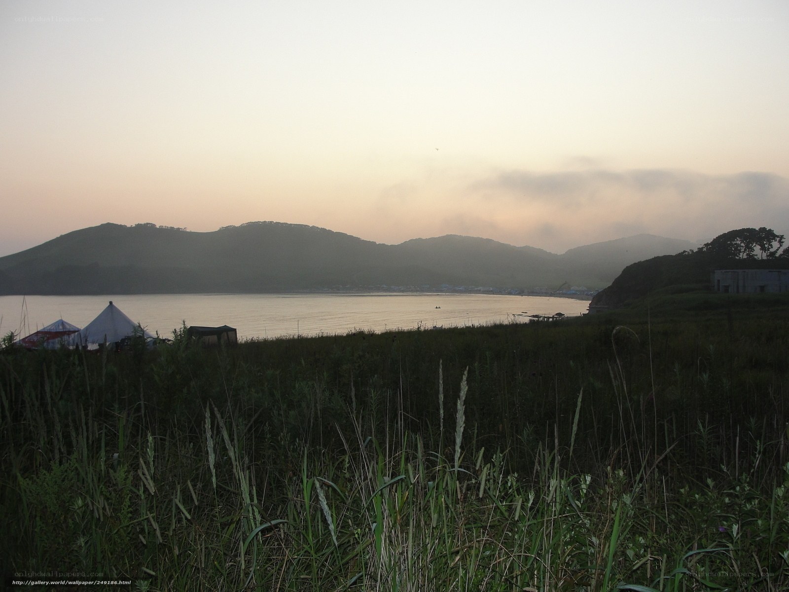 Camping by the lake at dawn