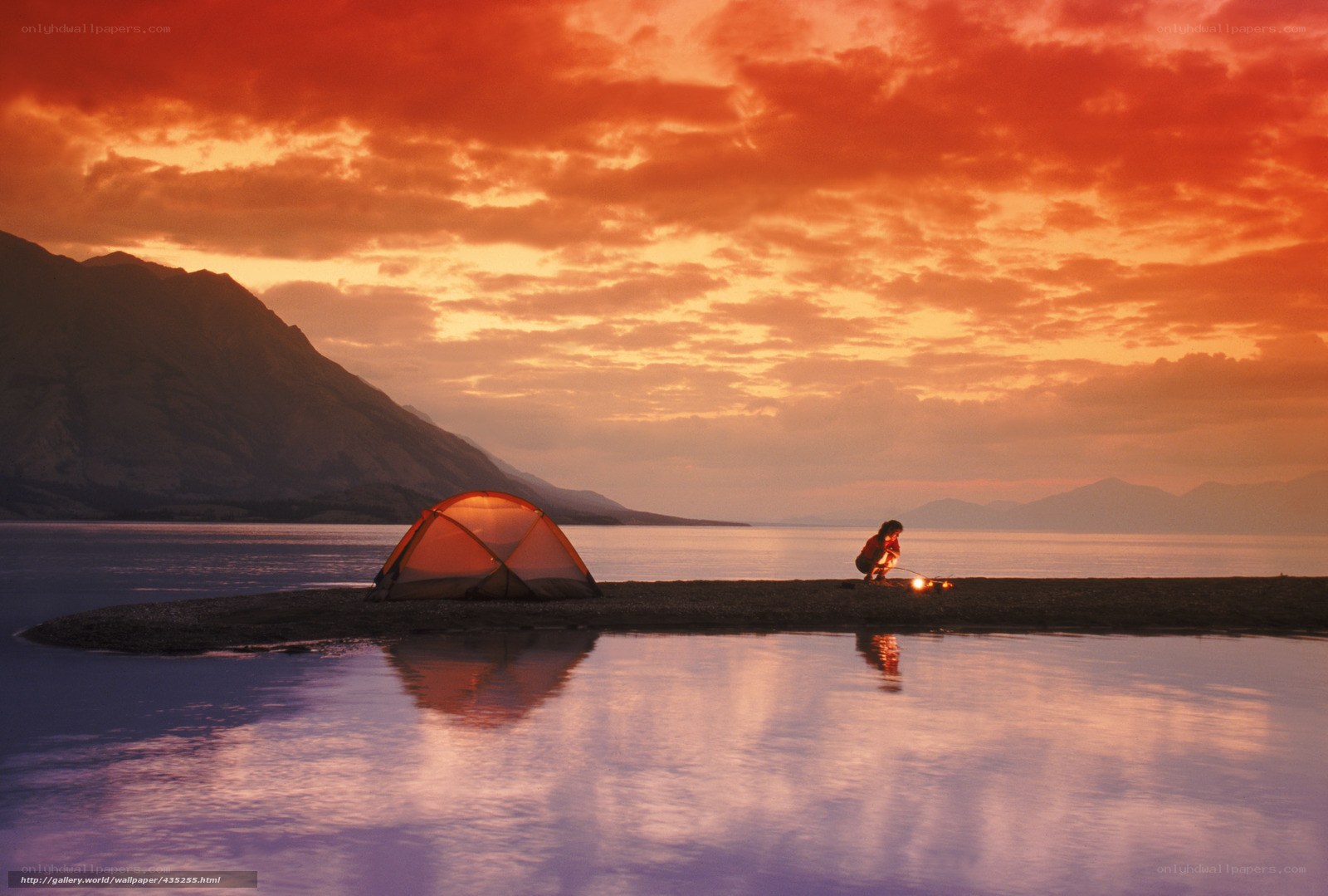 Camping by the lake at sunset