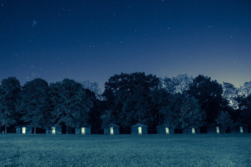 Camping cabins under starry sky