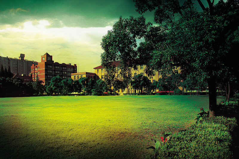Campus with green lawn and buildings