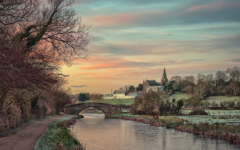 Canal and Village at Sunset