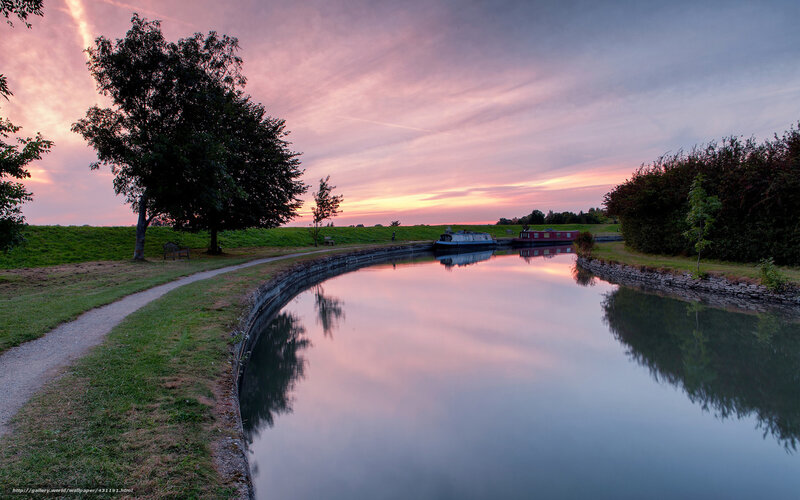 Canal at sunset with boats