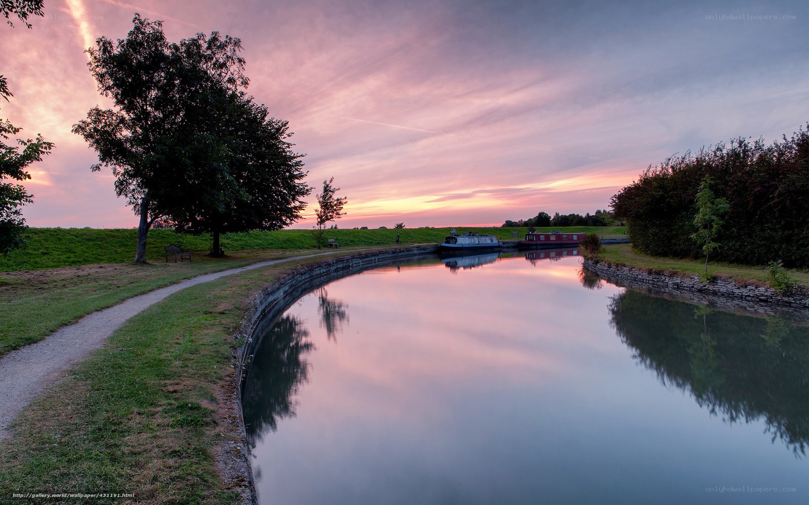 Canal at sunset with boats
