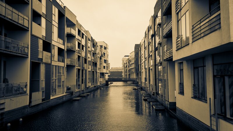 canal between modern buildings