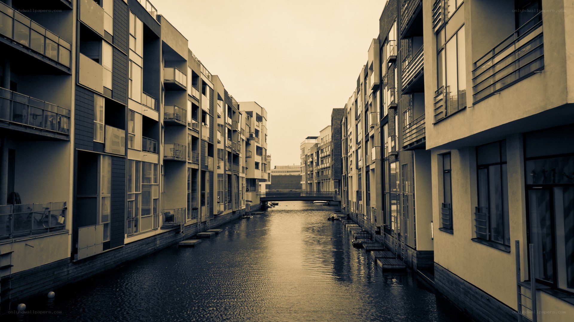 canal between modern buildings