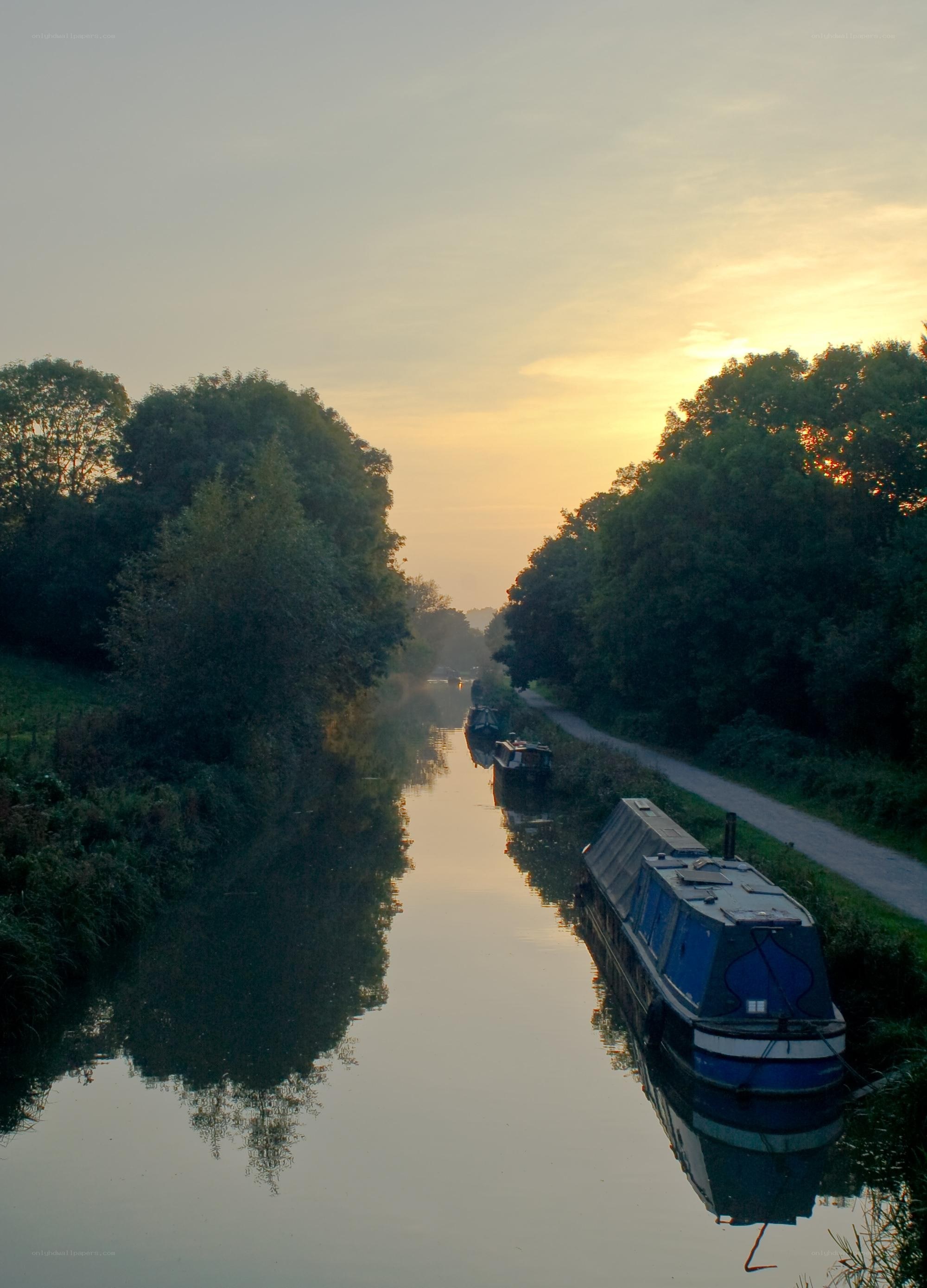 Canal boats at sunrise