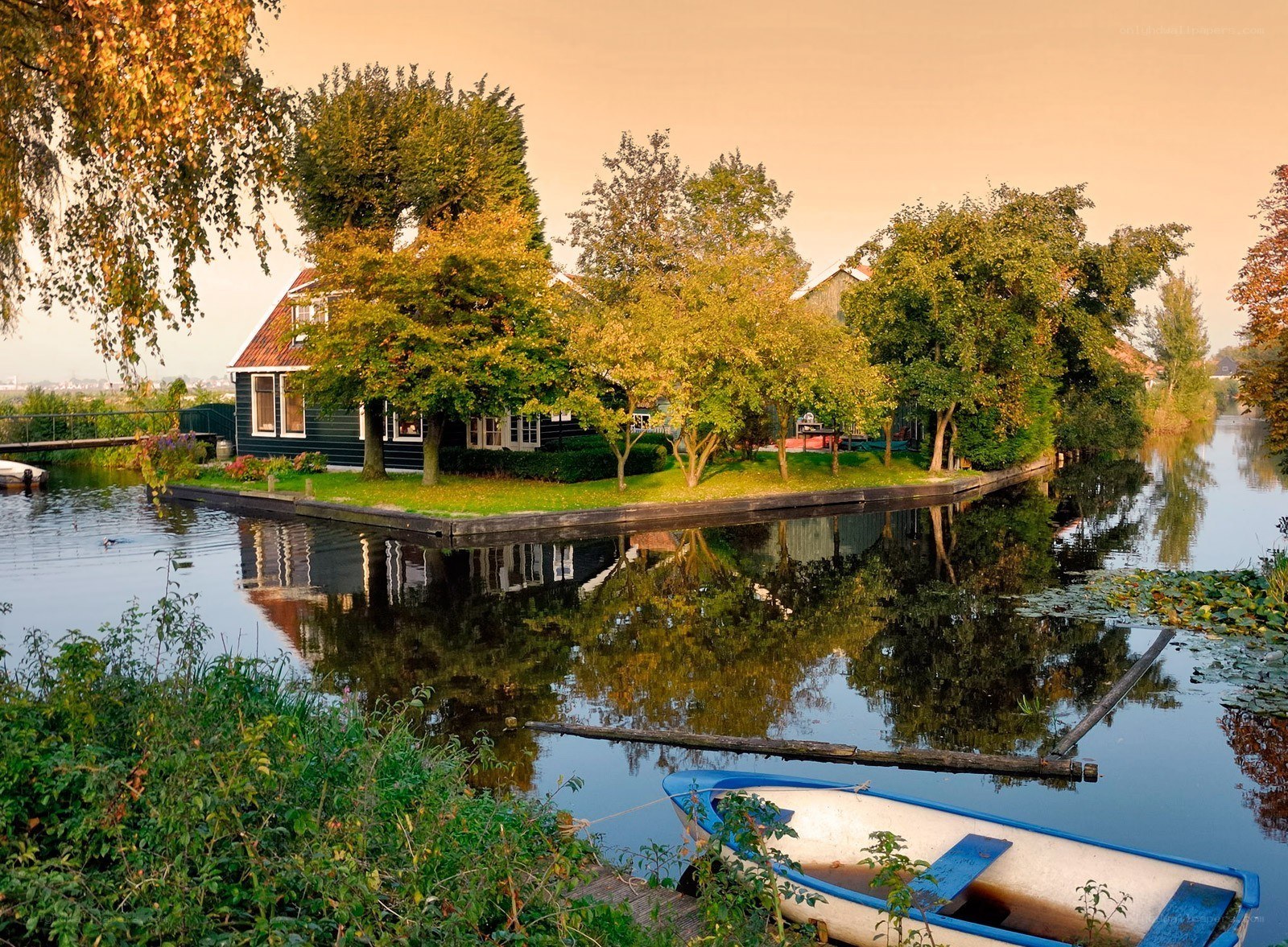 Canal house in autumn