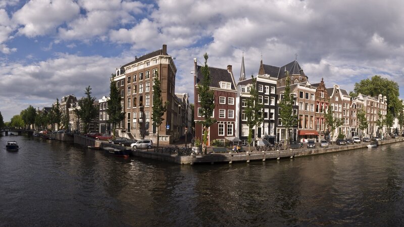 Canal Houses in Amsterdam — Brown, Serene, Afternoon, Photograph, Buildings, Trees