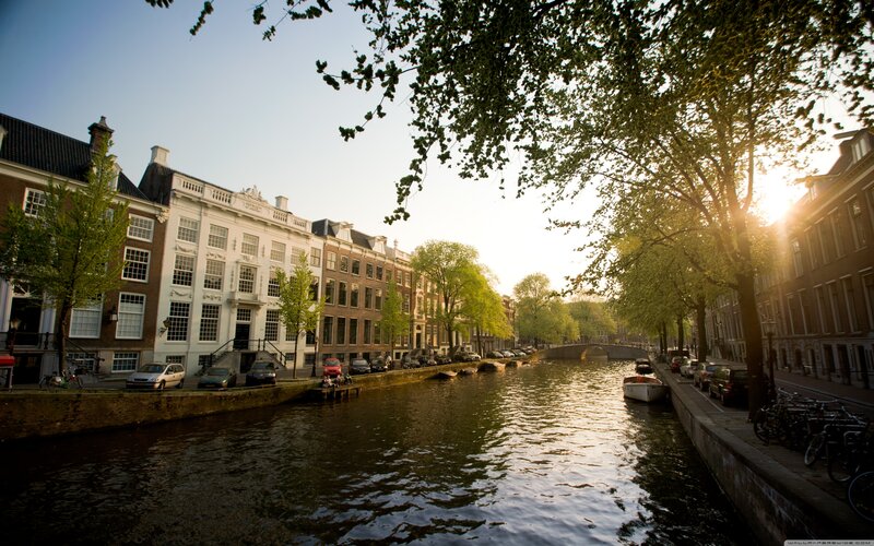 Canal in Amsterdam — Green, Serene, Sunset