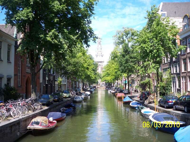 Canal in Amsterdam with church tower