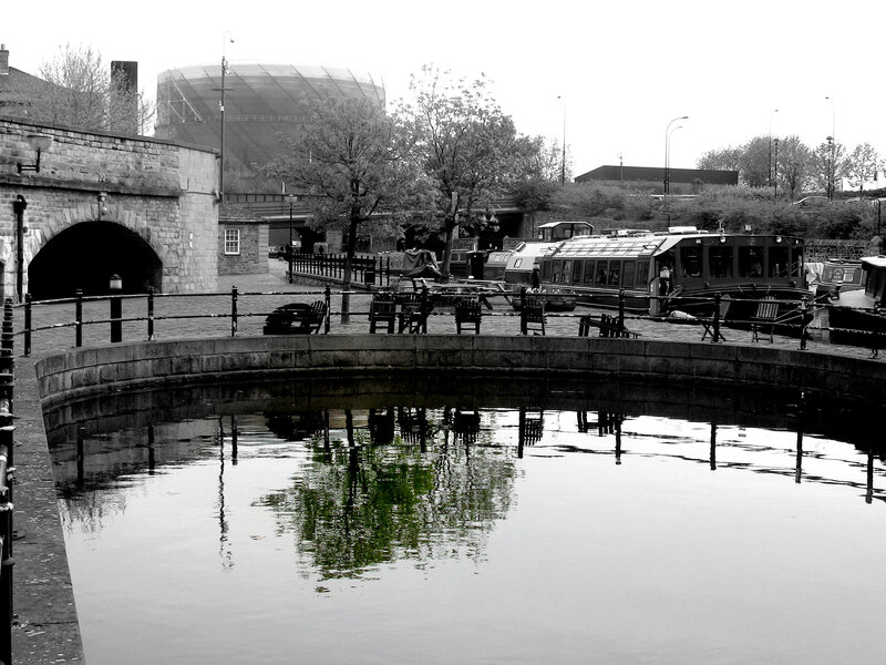 canal lock with boats and gas holder