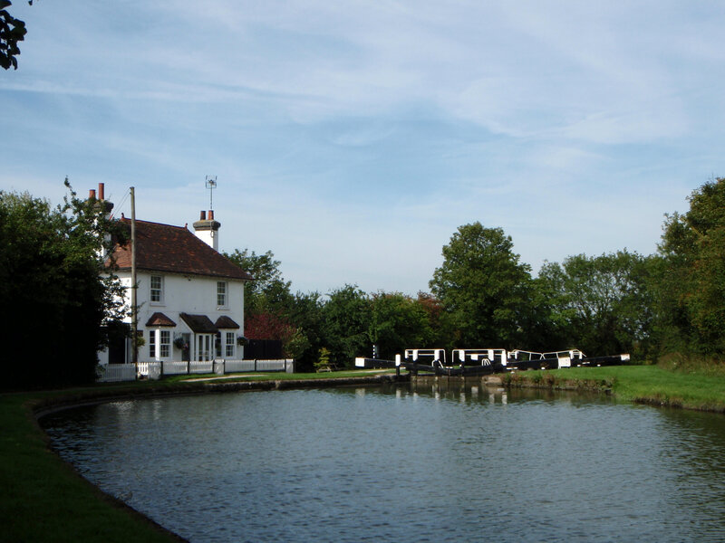 Canal lock with white house
