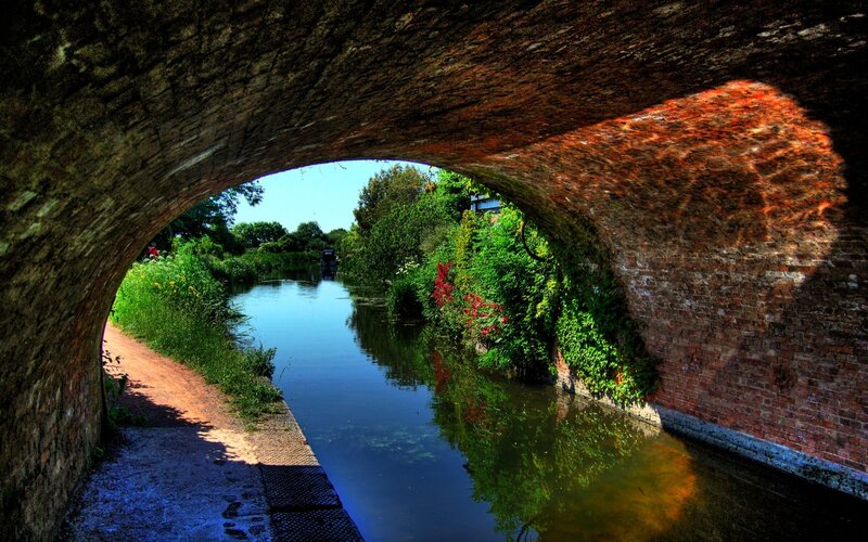 Canal under Brick Bridge — Green, Serene, Afternoon