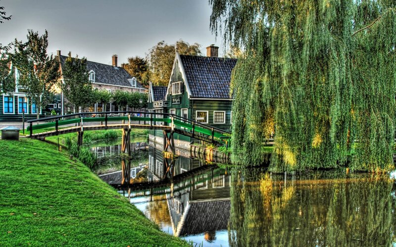 canal village with green bridge