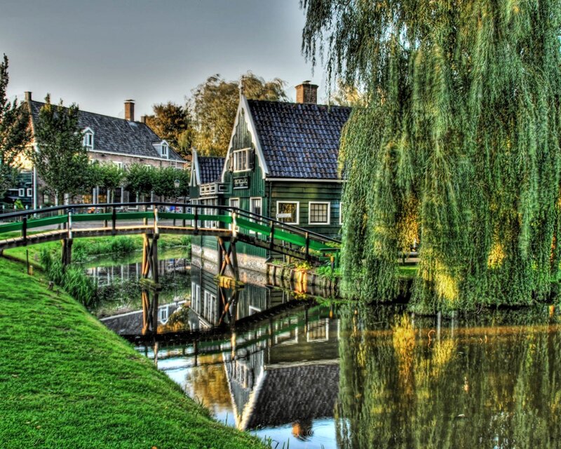 canal village with green bridge