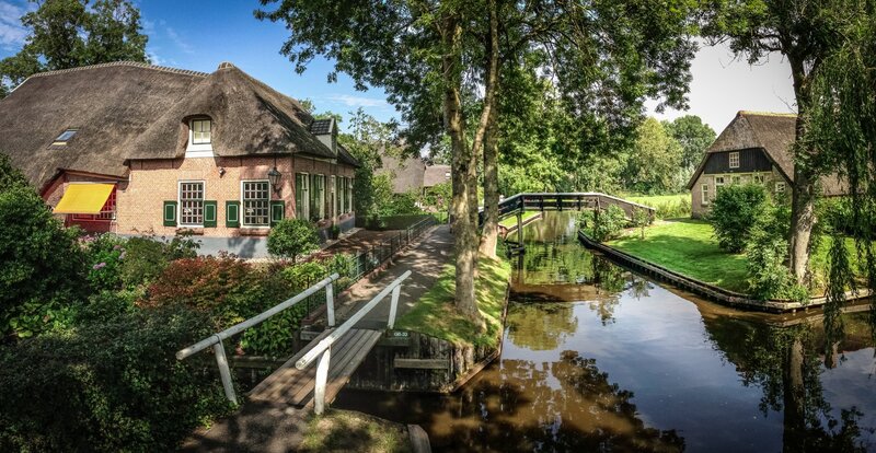 Canal Village with Thatched Houses