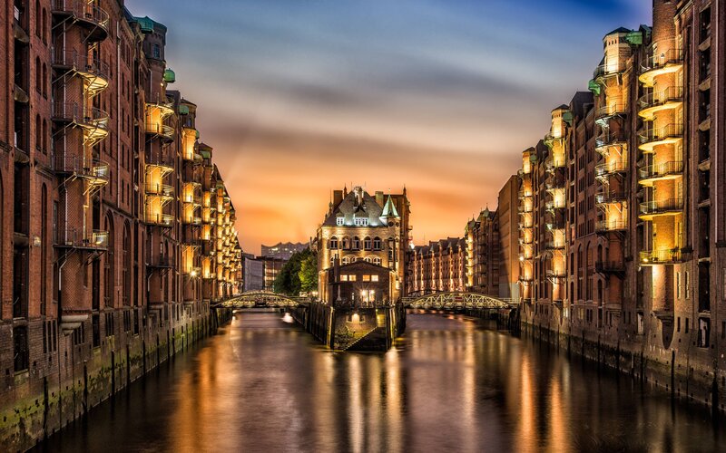 Canal with Brick Buildings — Orange, Serene, Sunset