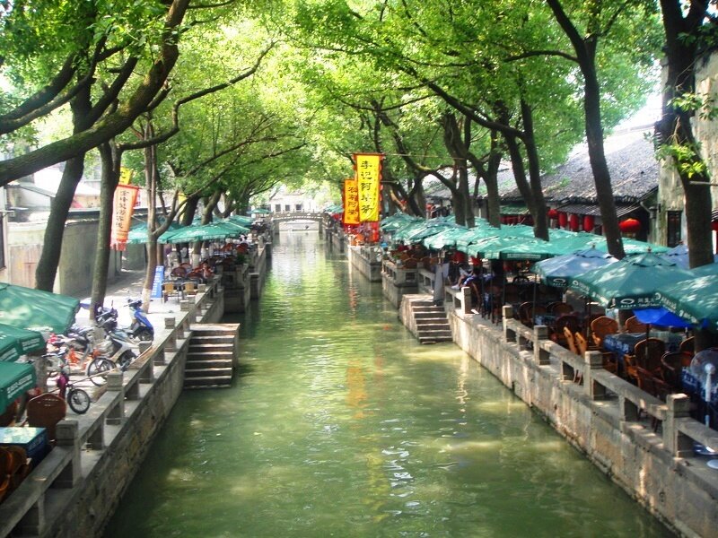 Canal with Green Umbrellas