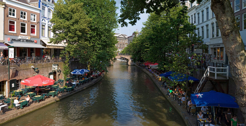 Canal with outdoor cafes in Amsterdam
