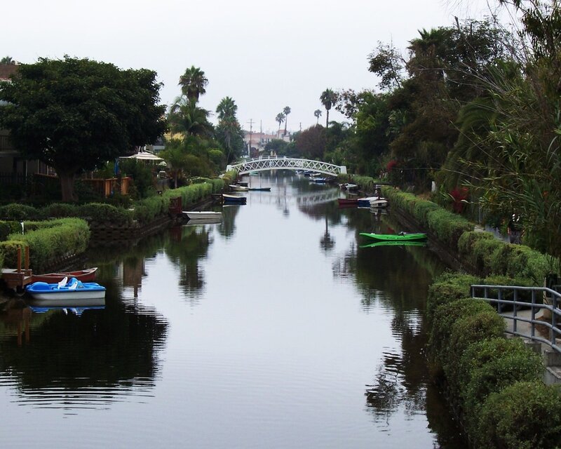 Canal with white bridge and boats
