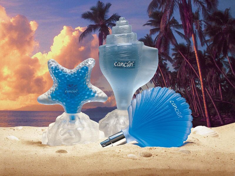 Cancun perfume bottles on beach