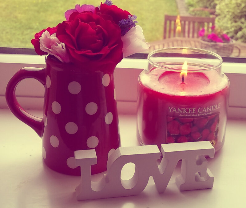Candle and Flowers on Windowsill