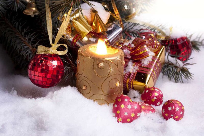 Candle and Ornaments in Snow
