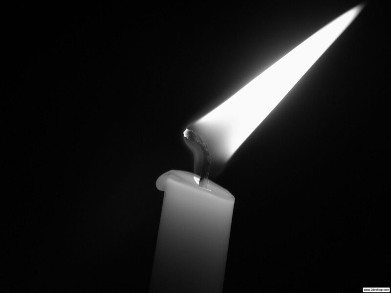 Candle flame in darkness