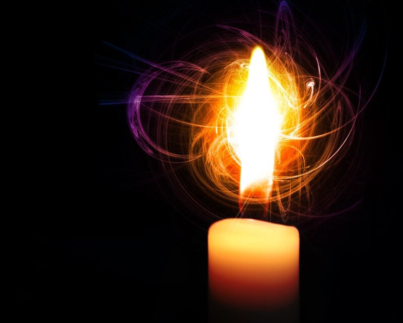 Candle flame with light trails