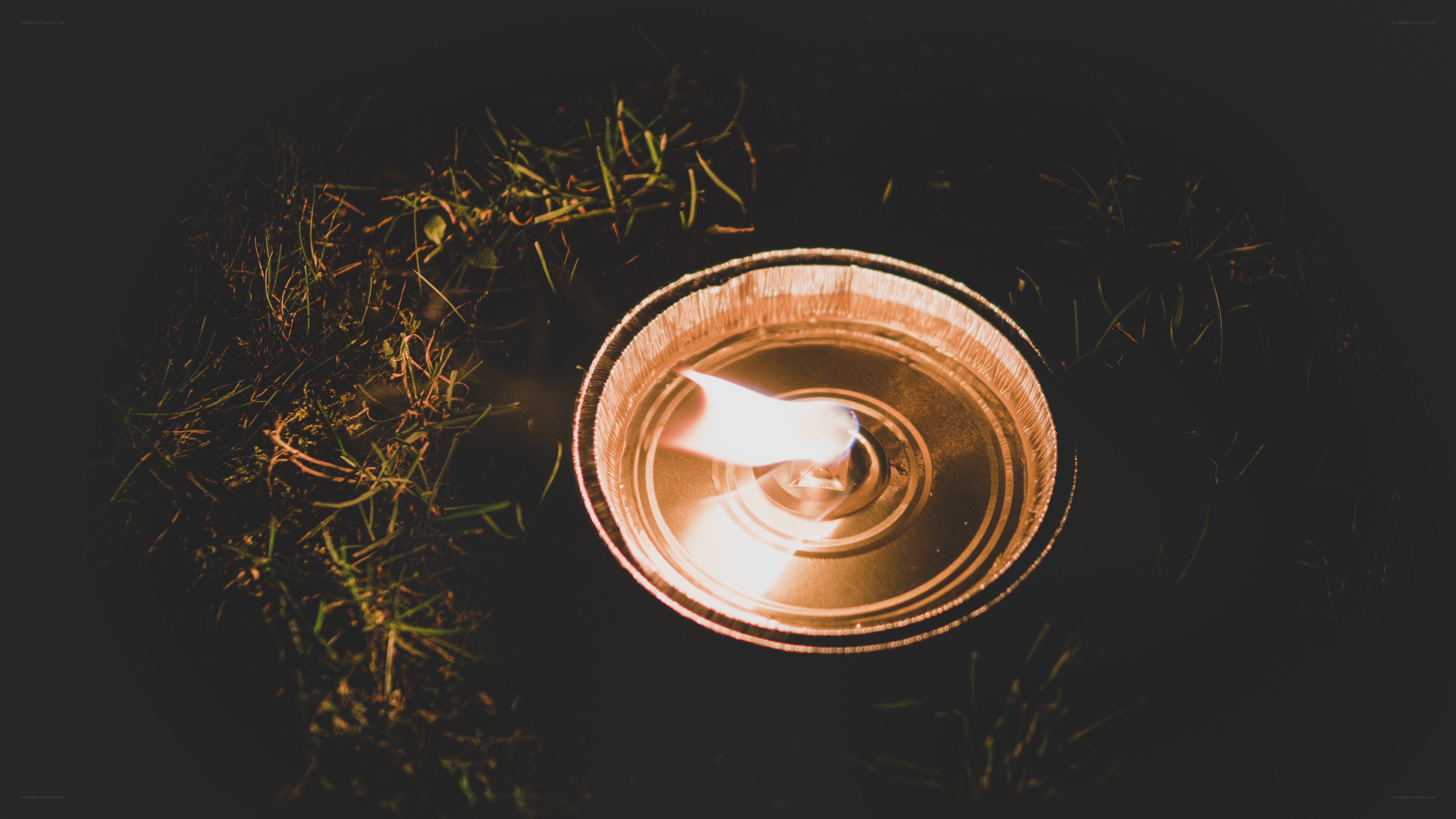 Candle in a tin container