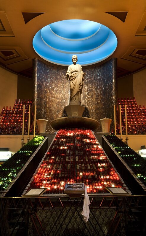 Candle-lit shrine with statue