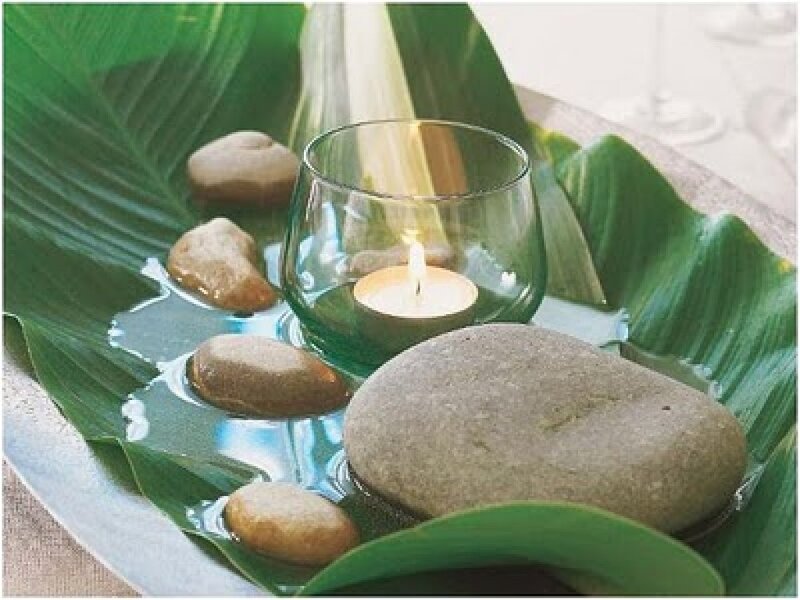 Candle on Green Leaves