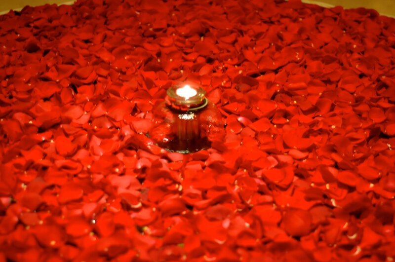Candle on Rose Petals
