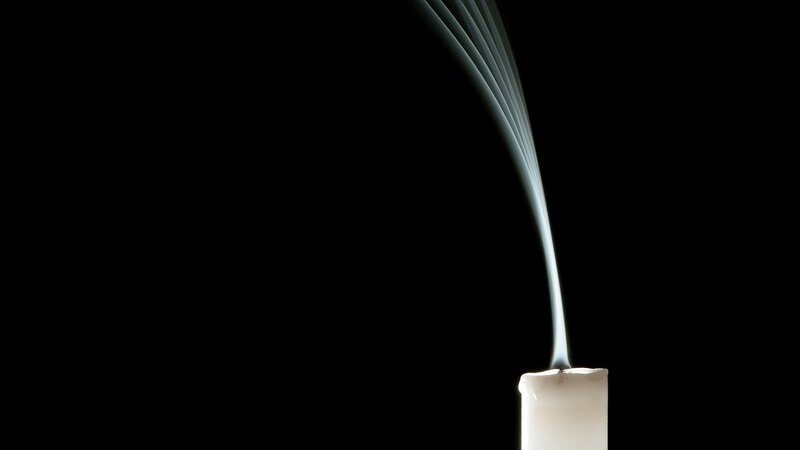 candle smoke against black