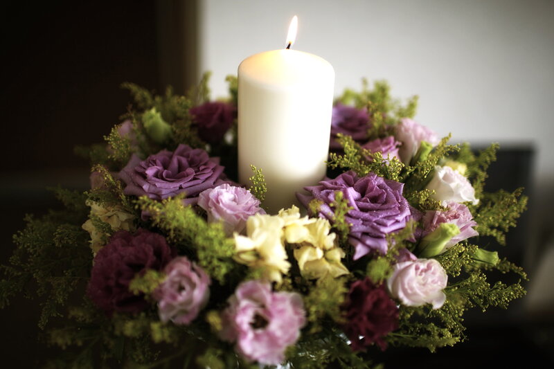 Candle Surrounded by Flowers