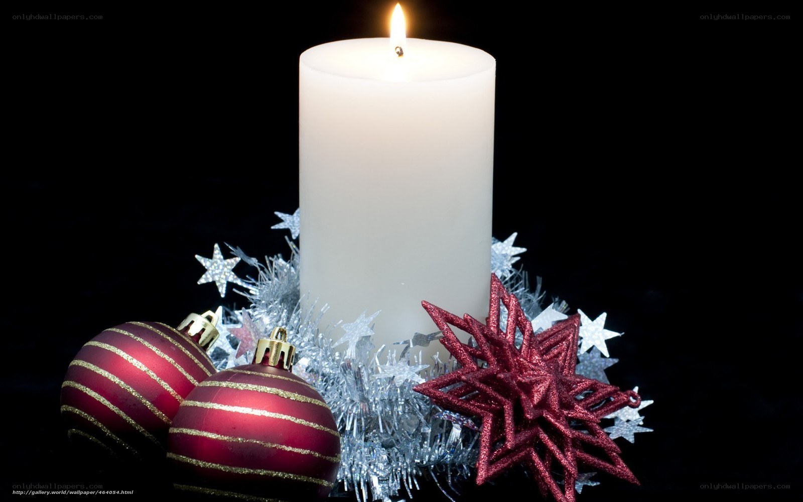 Candle with Christmas ornaments