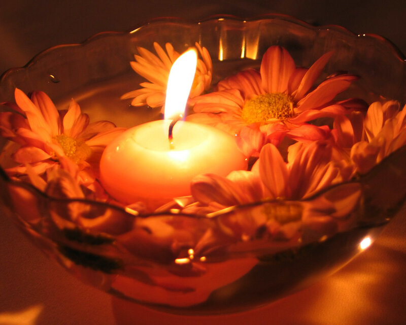 Candle with floating flowers